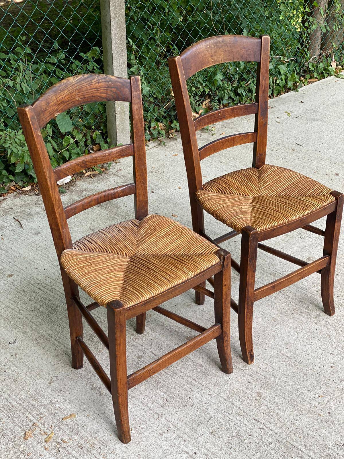 2 solid oak and straw wood chairs