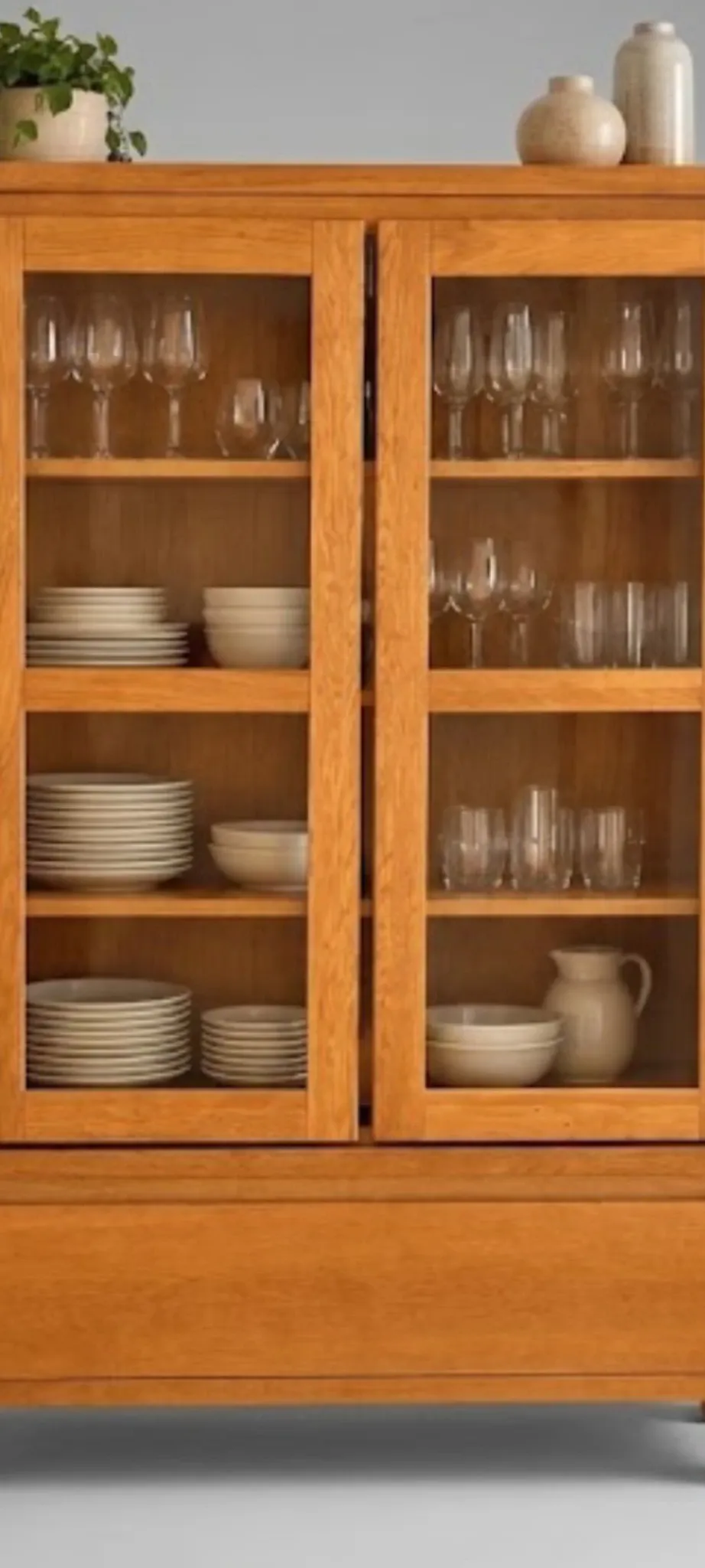 Glass display cabinet on legs