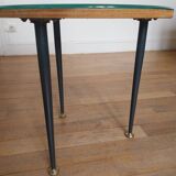 Small side table decorated with cigar rings under beveled glass