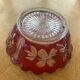 Red and transparent glass bowl with floral motifs and vintage wheat cobs