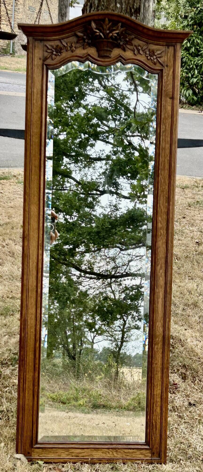 Large and old bevelled framed floor mirror.