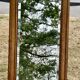 Large and old bevelled framed floor mirror.