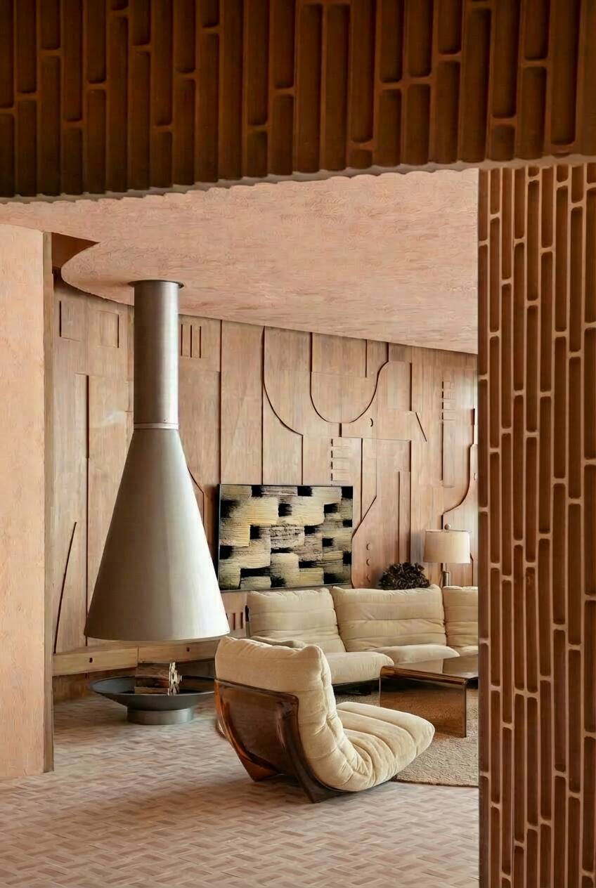 Marsala armchair and its light beige Ligne Roset footrest.