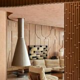 Marsala armchair and its light beige Ligne Roset footrest.