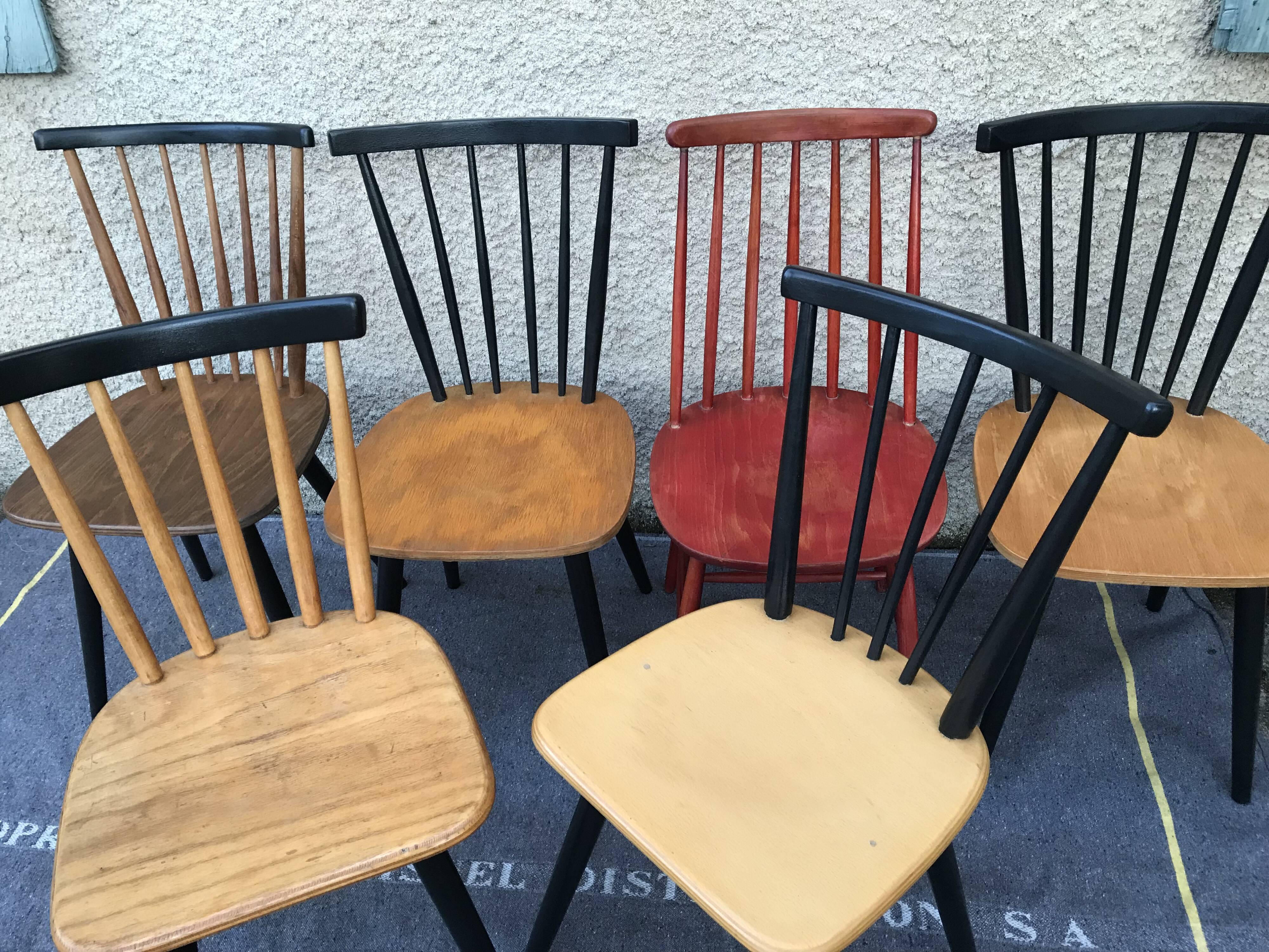 Set of 6 mismatched vintage chairs with bars and compass legs