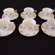 Set of six Art Deco white fine porcelain coffee cups and saucers