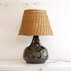 Ceramic and rattan lamp from the 20th century.