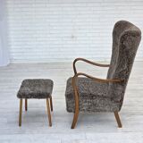 1960s, reupholstered Danish armchair, with stool, genuine sheepskin.