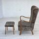 1960s, reupholstered Danish armchair, with stool, genuine sheepskin.