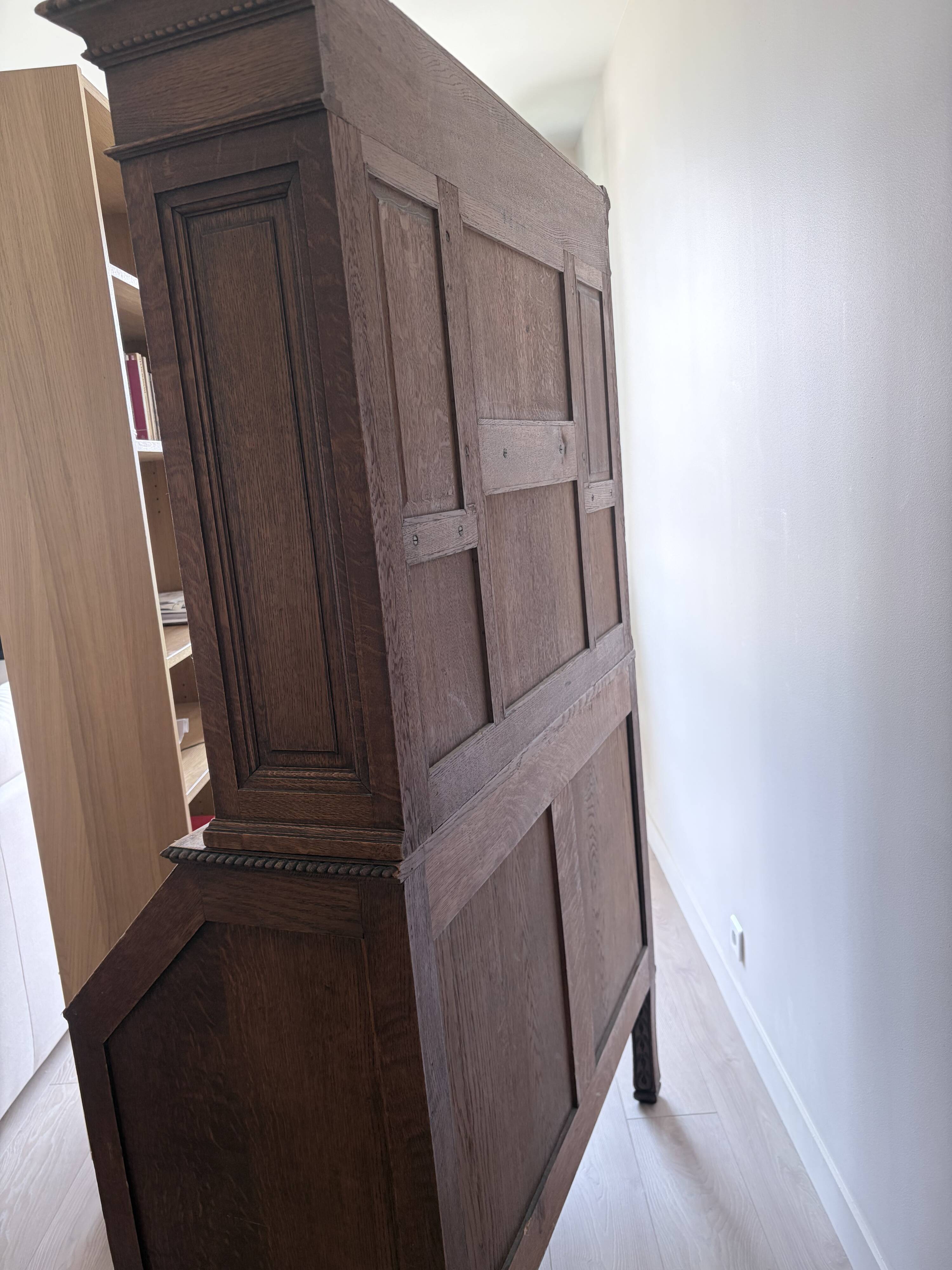 Large secretary with a drop-down front in carved oak, neo-Renaissance style.