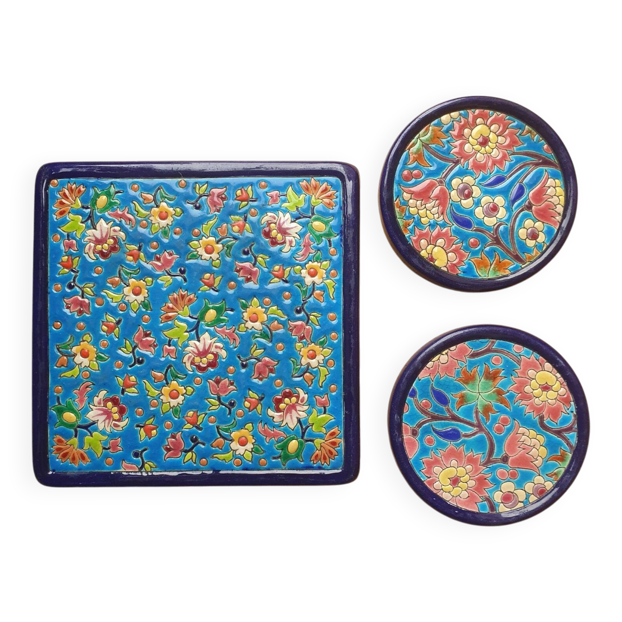 Trivet and Longwy enamel bottle