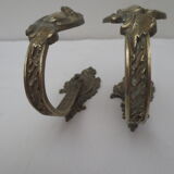 Pair of embraces in brass or bronze