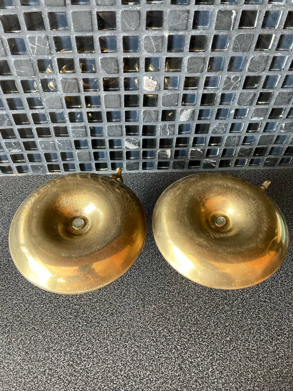 Two brass hand candle holders