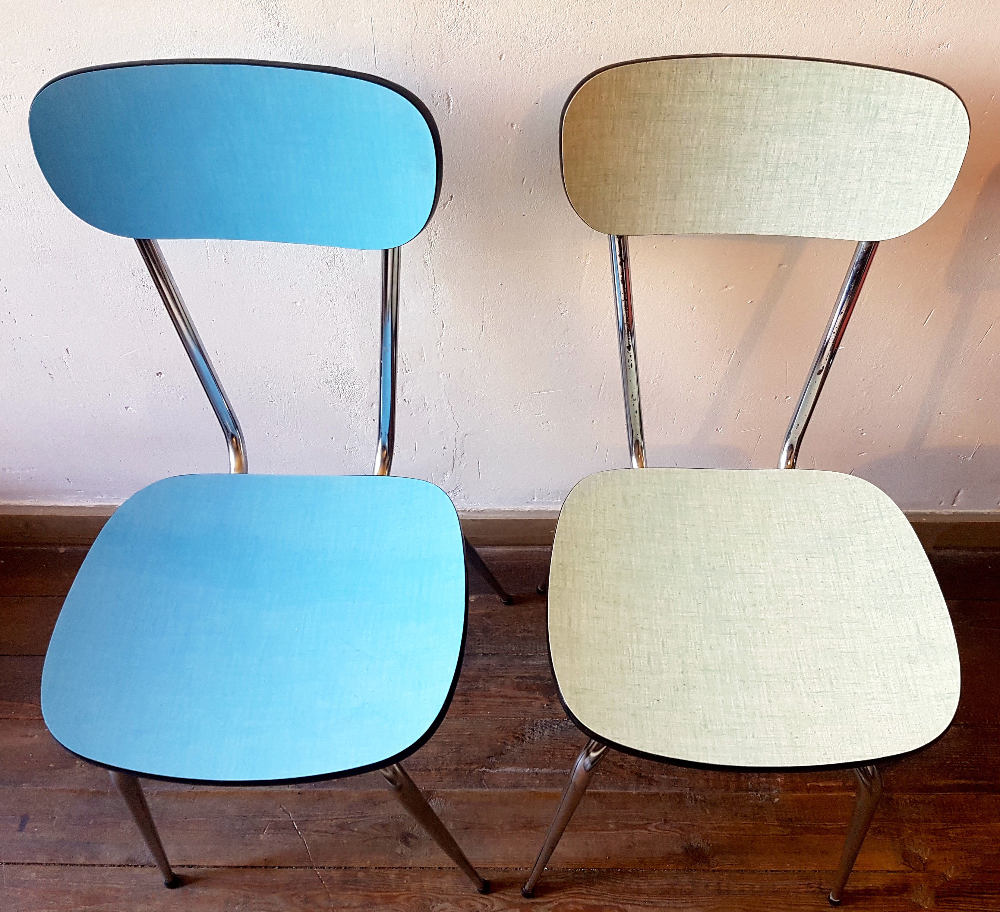 Four formica chairs in different colors