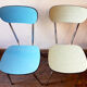 Four formica chairs in different colors