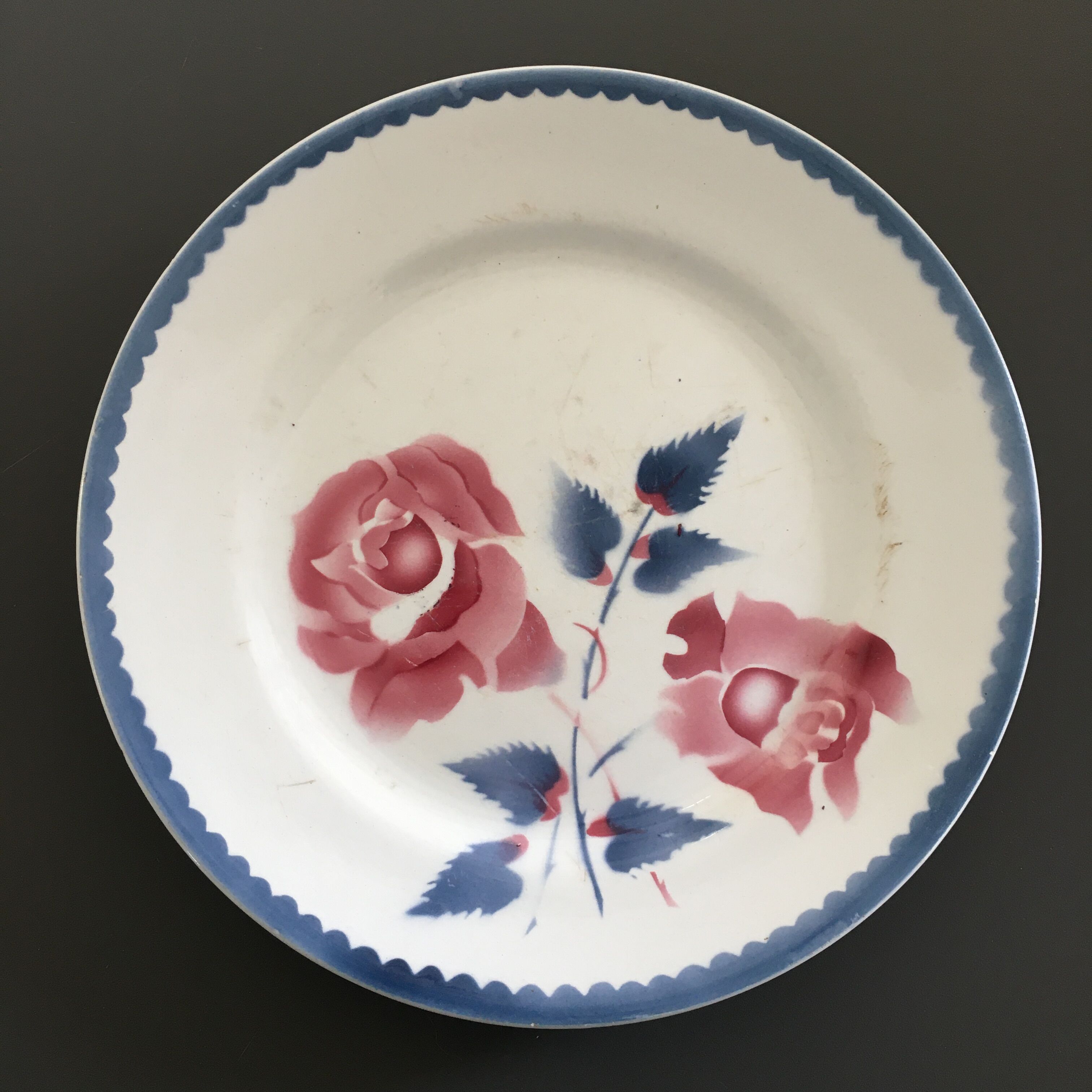 Antique plate decorated with roses