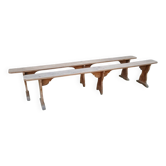 Pairs of large benches in raw fir wood.