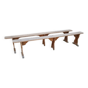 Pairs of large benches in raw fir wood.