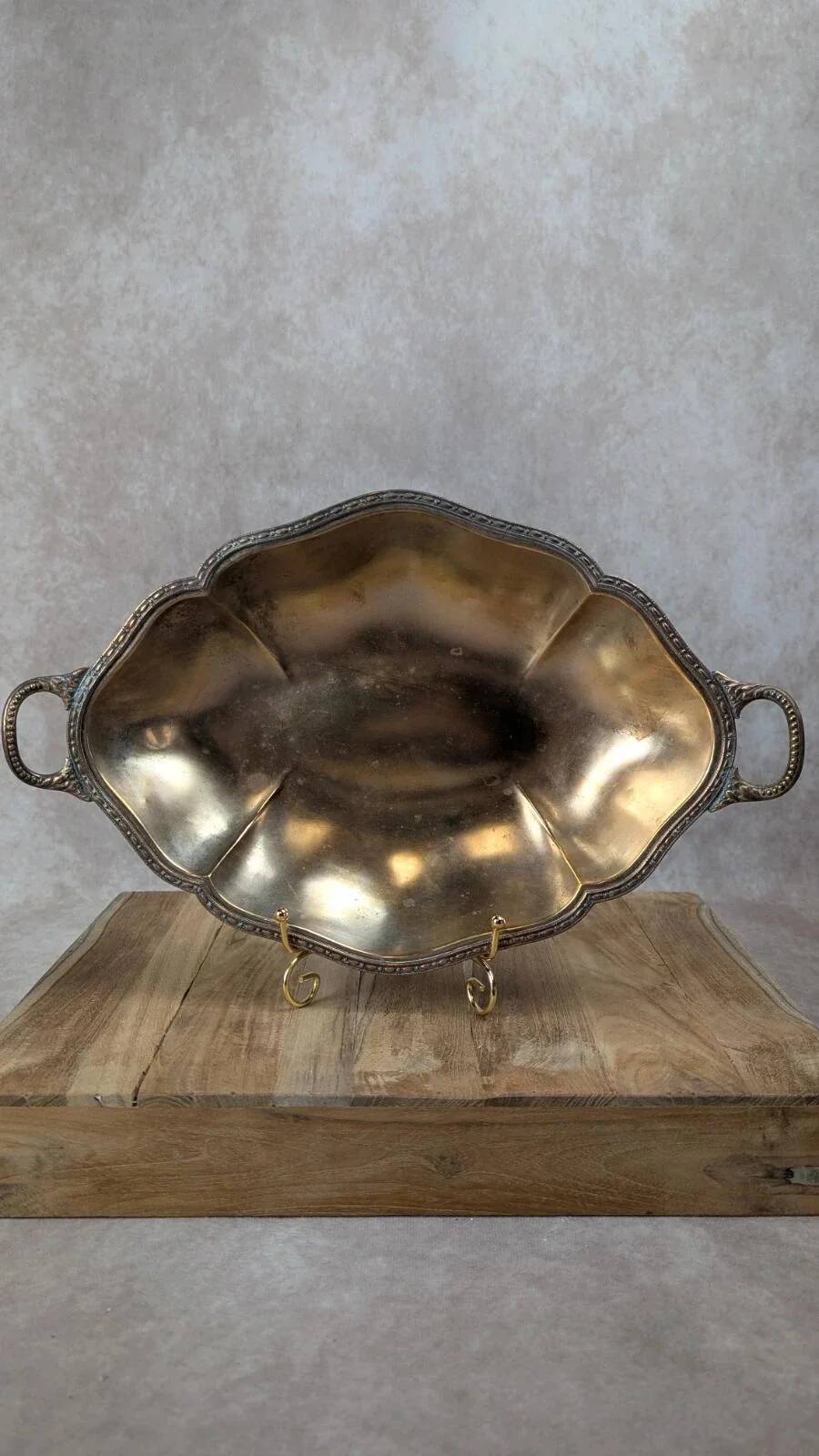 Antique oval silver-plated copper tray with handles.