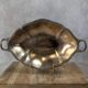 Antique oval silver-plated copper tray with handles.