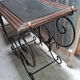 Pair of wrought iron and blackened wood consoles from the mid-20th century.