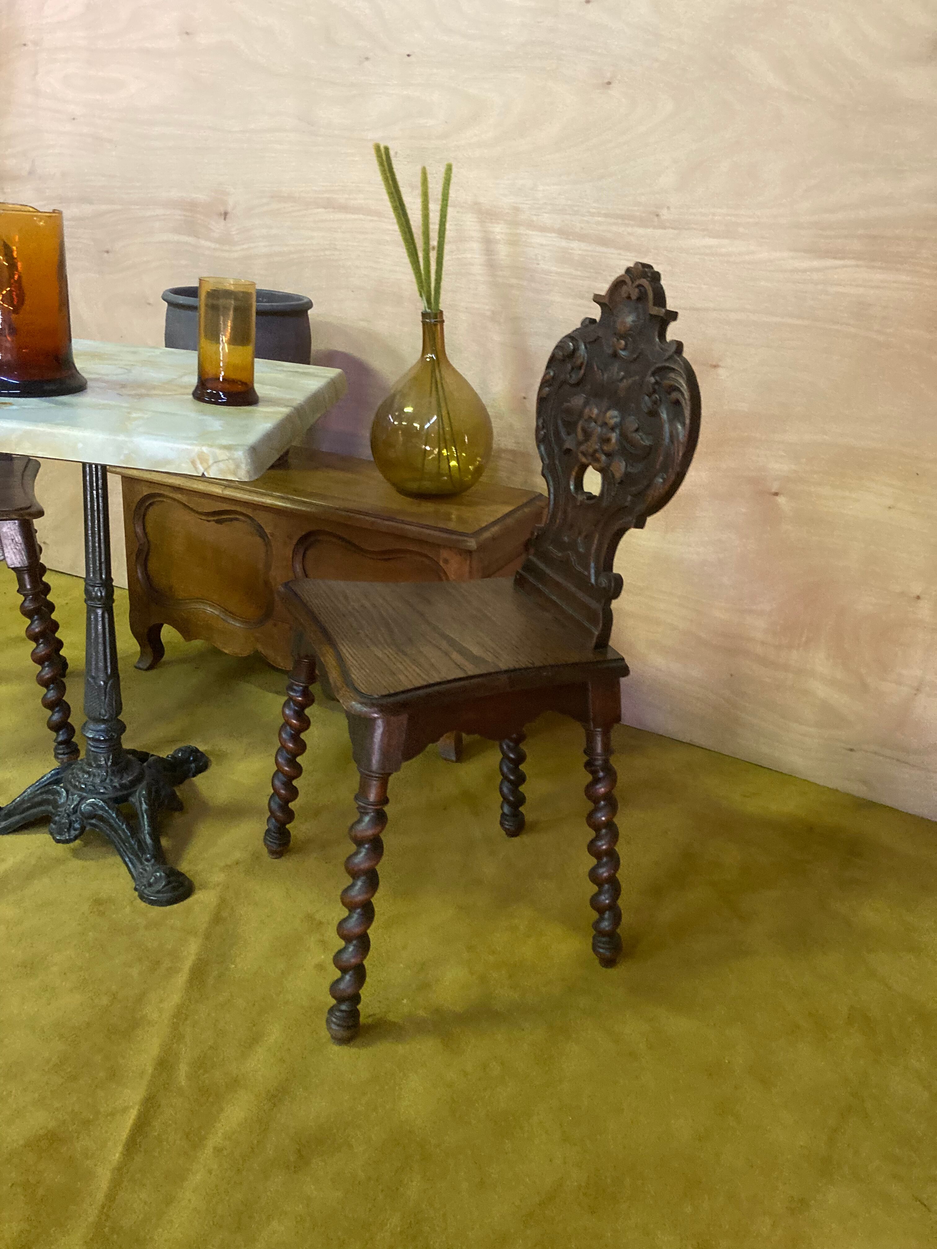 Duo of carved wooden chairs