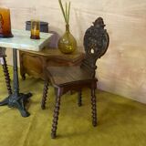 Duo of carved wooden chairs