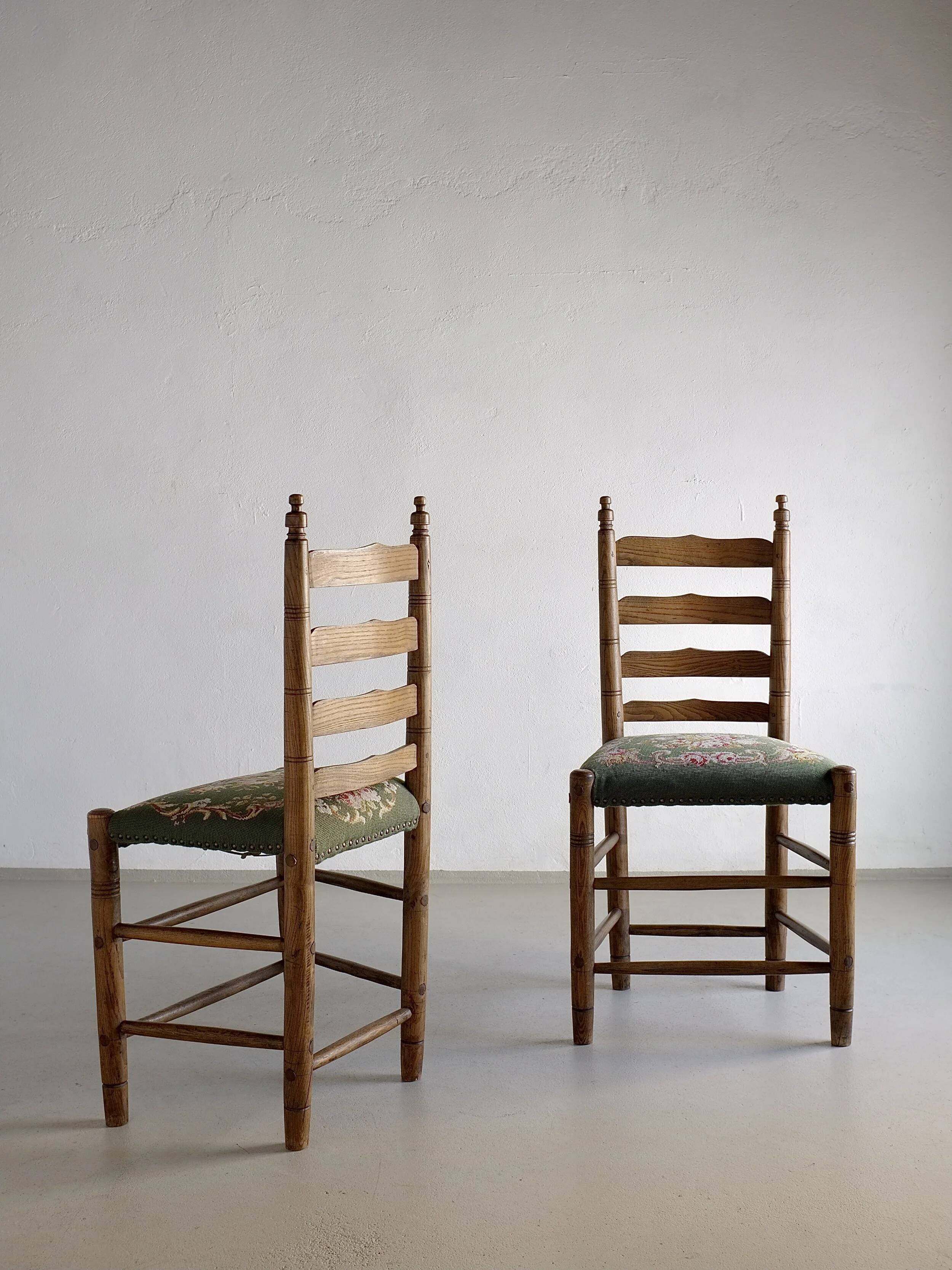 Rustic ladder-back oak chairs with embroidered seats | Netherlands | 1950s