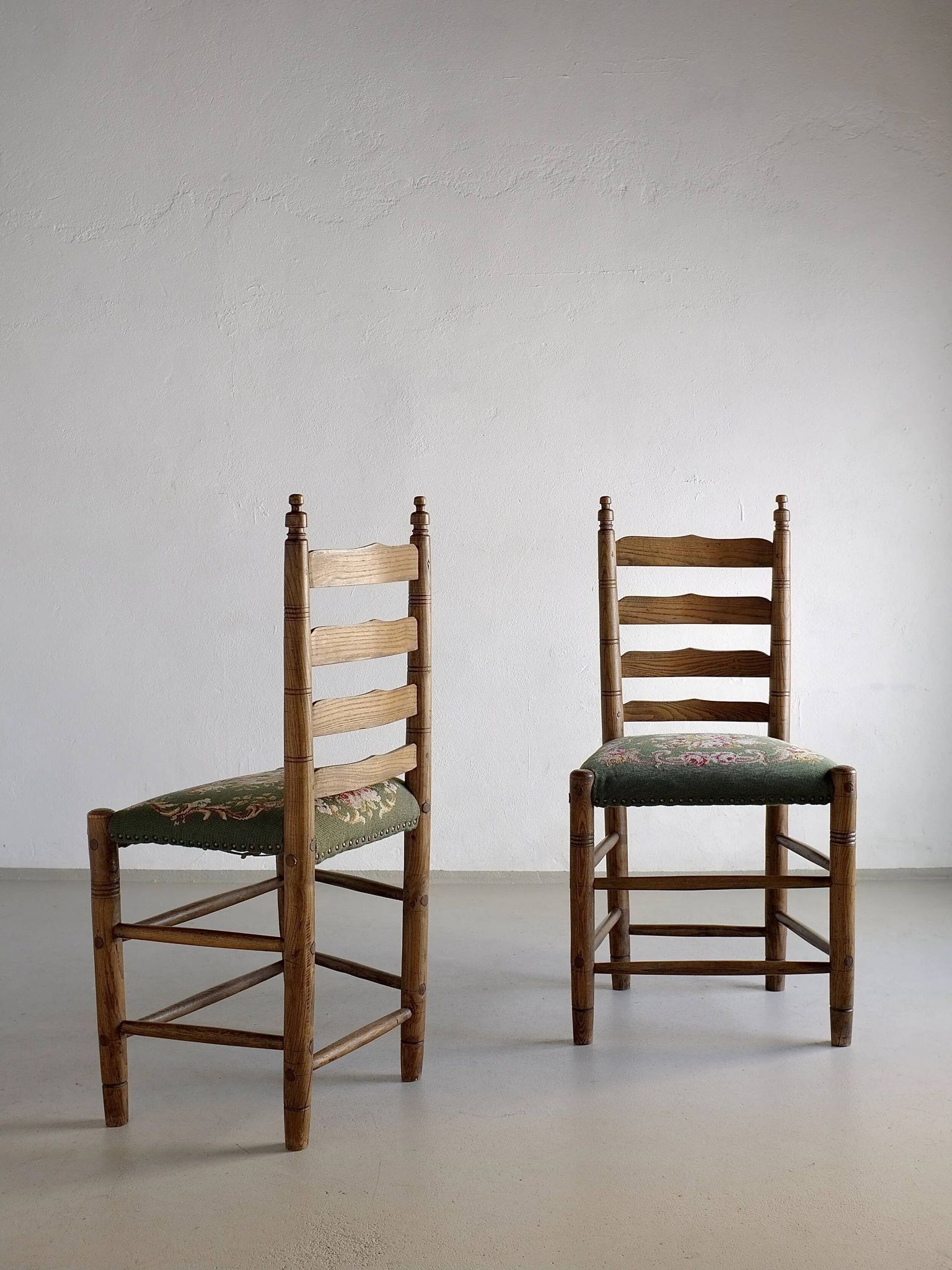 Rustic ladder-back oak chairs with embroidered seats | Netherlands | 1950s