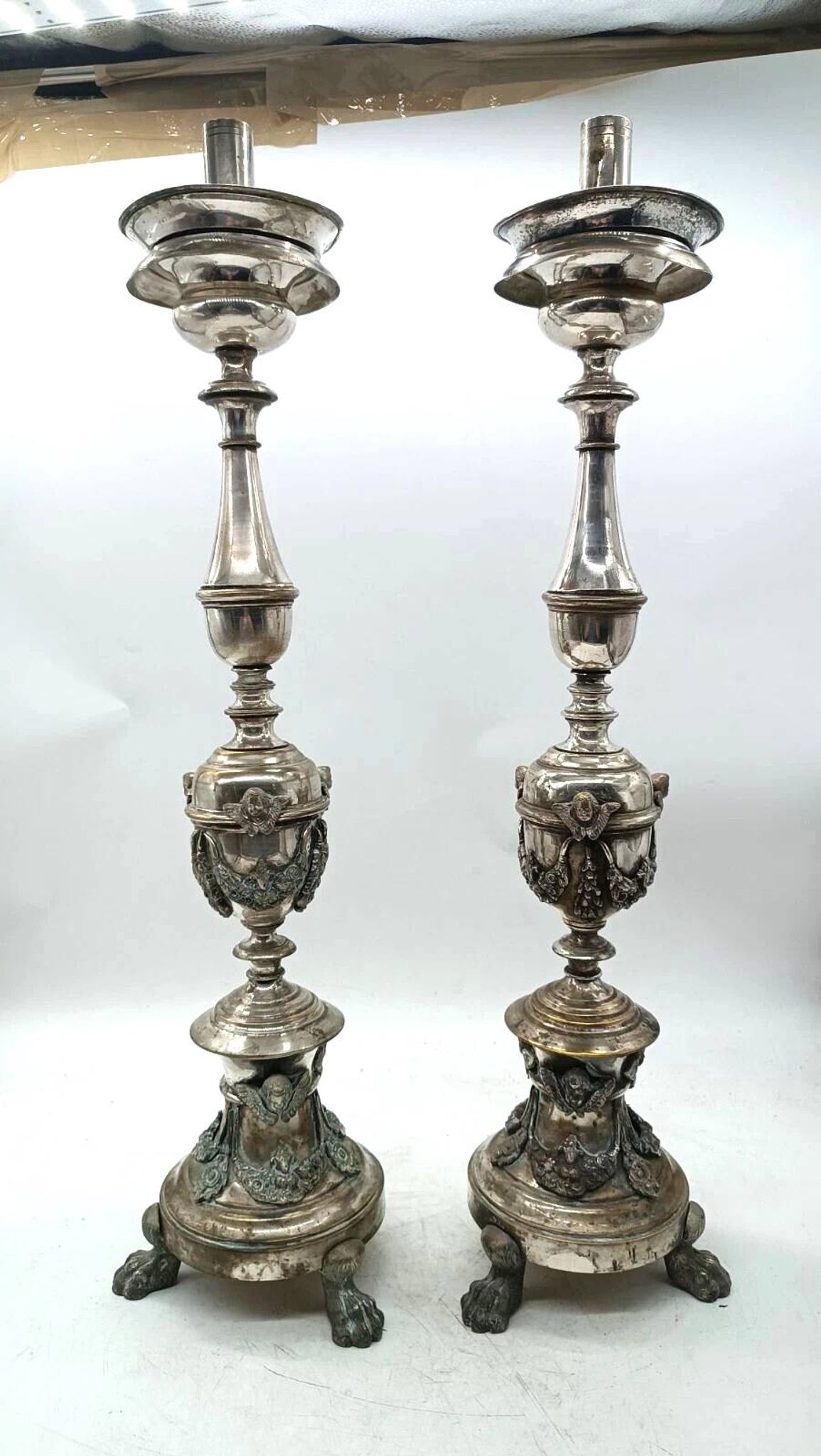 Pair of silver-plated bronze candlesticks in the Empire style, early 19th century, height 70 cm