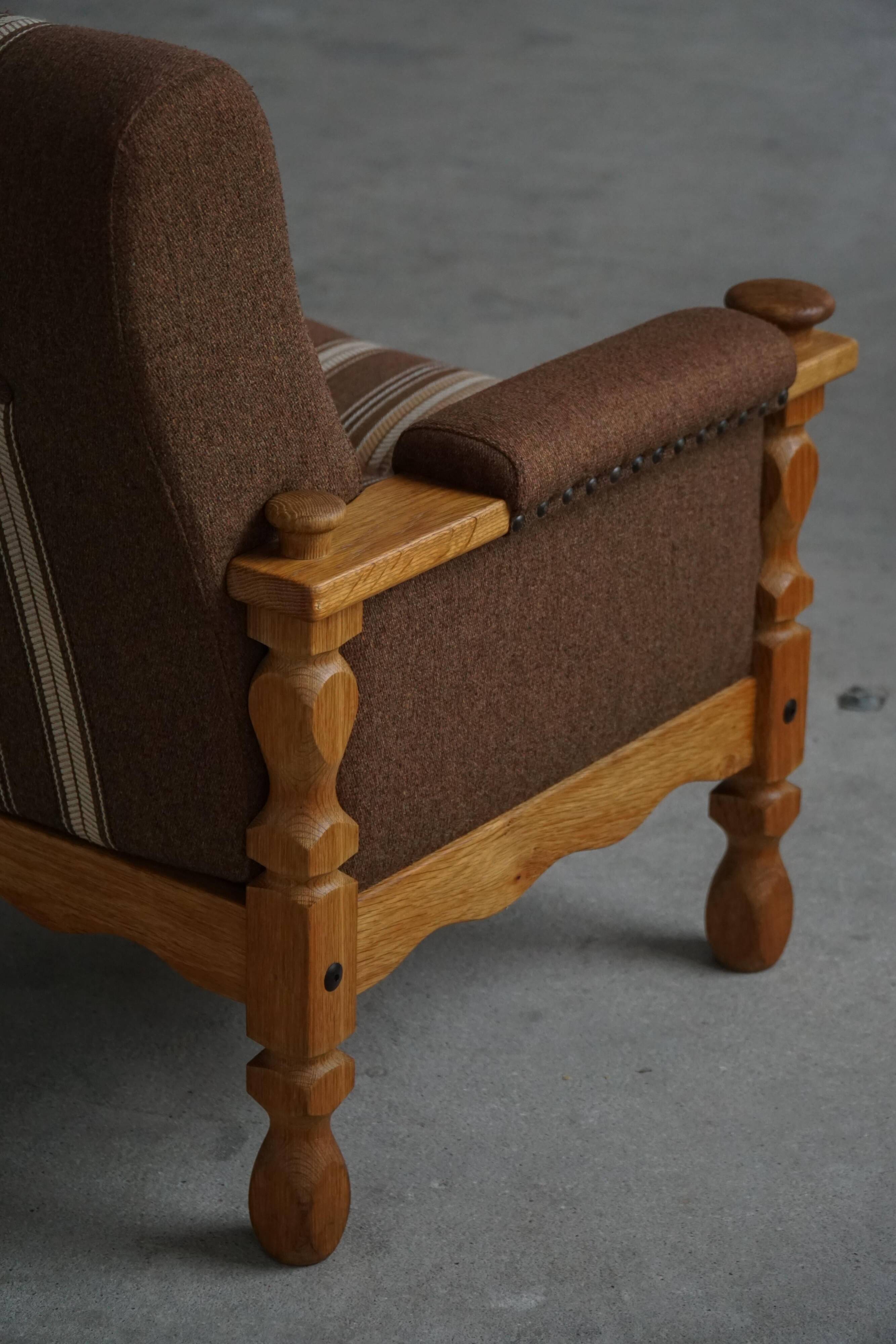 Modern Danish, a pair of lounge chairs in oak and wool, Henning Kjærnulf, 1960s.