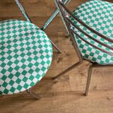 4 chrome chairs with green and white checkered tiles