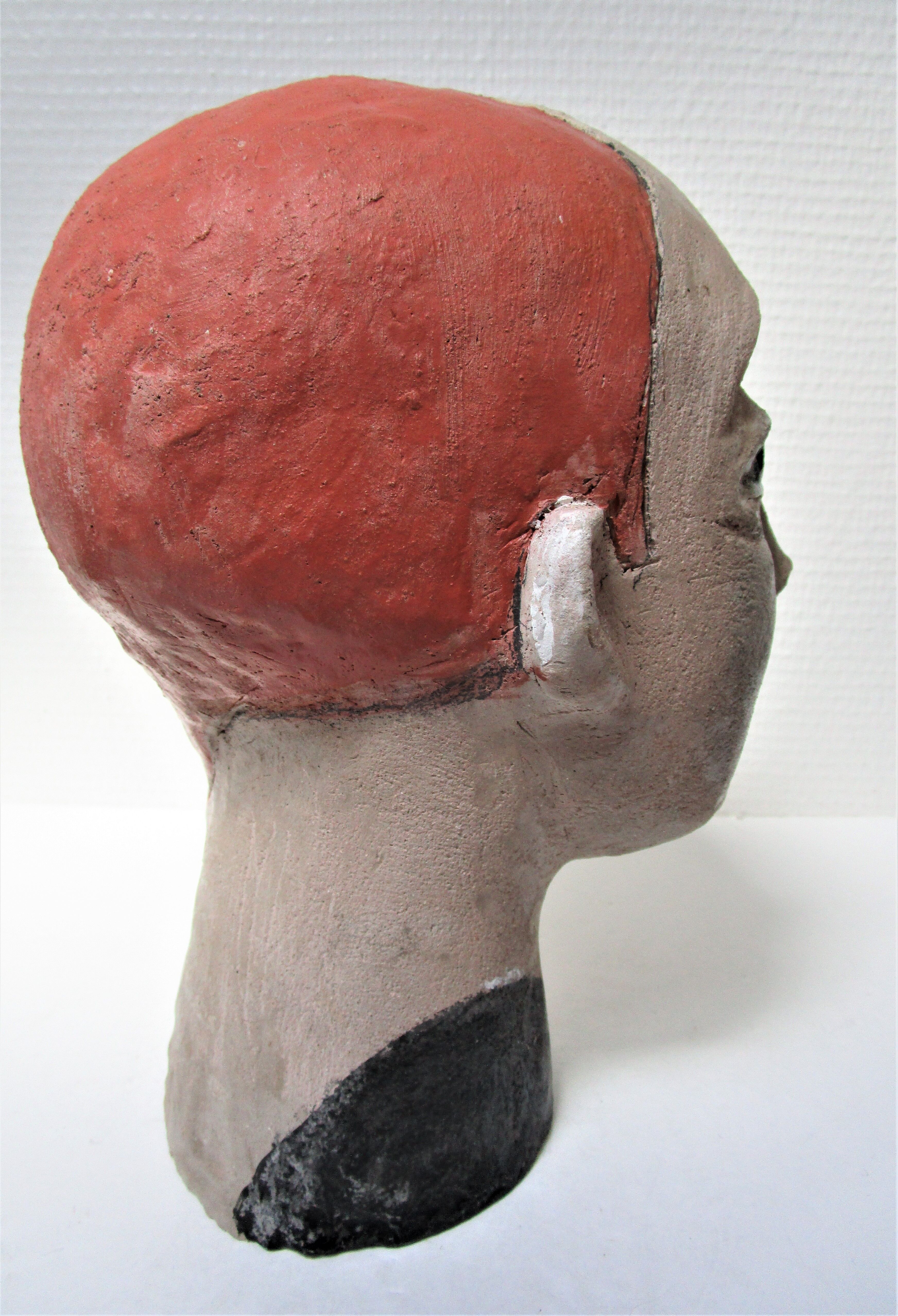 Redheaded boyish woman modeled in earth signed 60/70 years