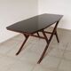 1950s Ilse Möbel coffee table with a black glass top.