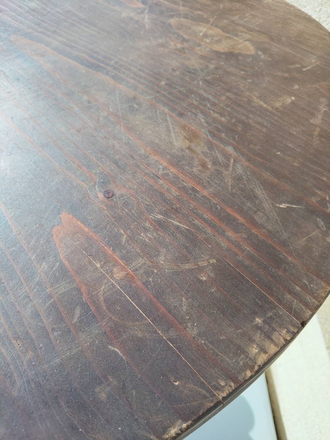 Small rustic antique tripod side table made of solid wood.