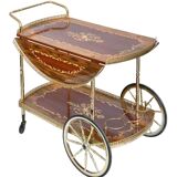 Serving table and rolling bar with drop leaves featuring floral marquetry decoration.