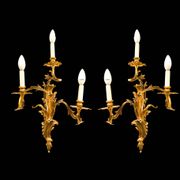 Paire d'appliques en bronze doré de style rocaille, trois lumières