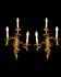 Pair of gilded bronze wall sconces in Rococo style, three lights.