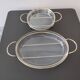 2 glass dishes with silvered steel frames from the 1960s, very good quality.