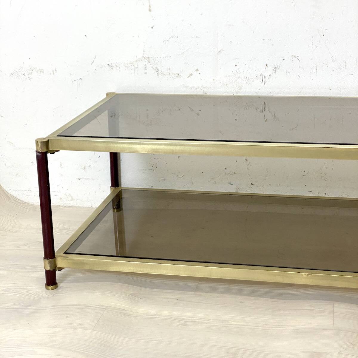 Vintage 1970s gold metal and smoked glass coffee table.