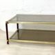 Vintage 1970s gold metal and smoked glass coffee table.