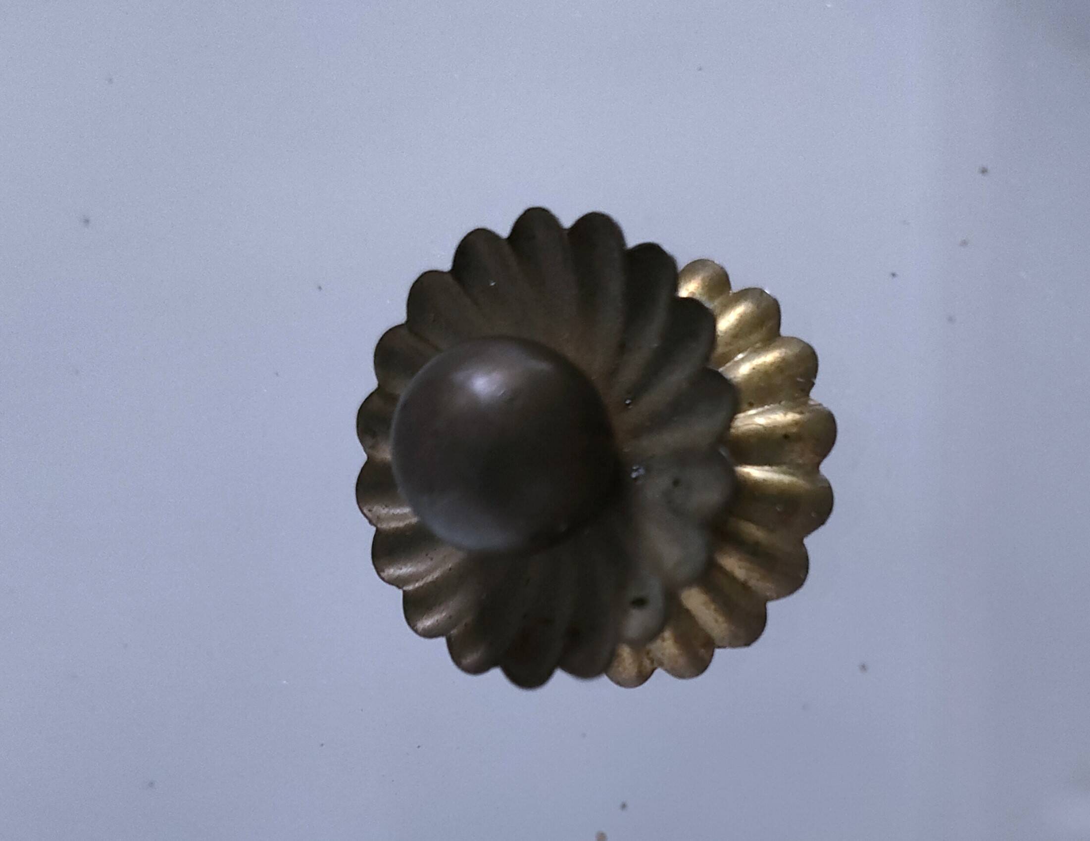 Octagonal mirror with brass hubcaps from the 60s