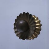 Octagonal mirror with brass hubcaps from the 60s