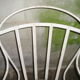 Fauteuil de jardin fer forgé à lames flexibles rivetées début XXè