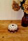 Vintage Jersey Pottery pique flowers in ceramic with a brown pattern from the 1970s.
