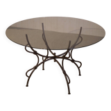 Folding wrought iron table base and indoor/outdoor glass top