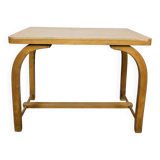 Old curved wooden children's desk.