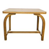 Old curved wooden children's desk.