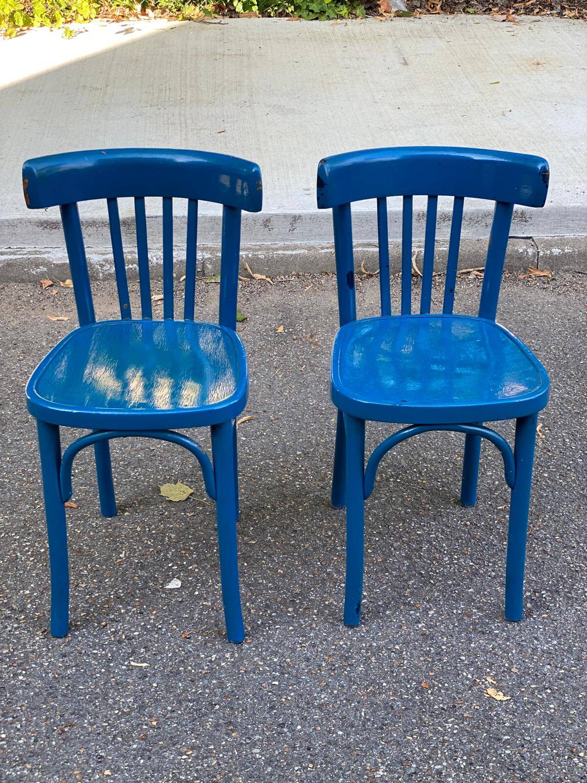 2 blue bistro chairs in curved solid wood