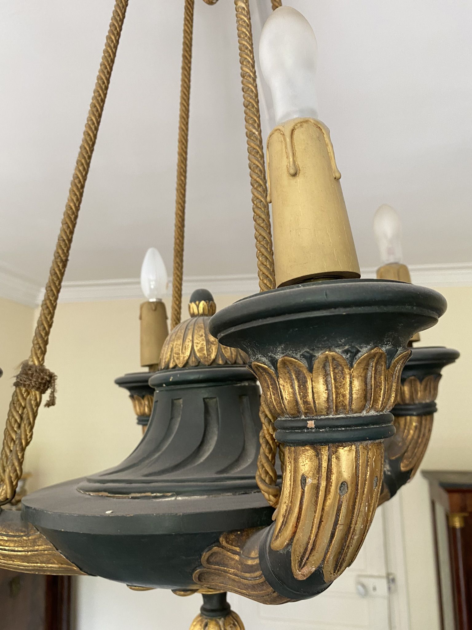 Empire style chandelier with four lights in sheet metal, bronze with patina and gilding